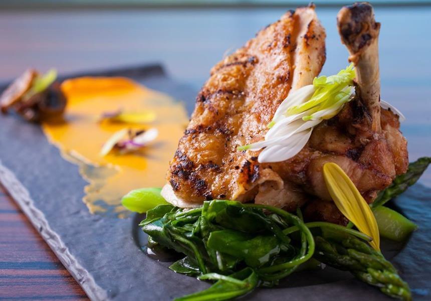 Chicken on a plate with some veggies