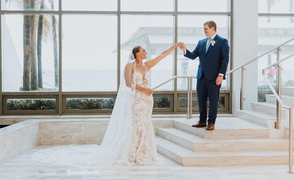 The bride and groom posing for a photo