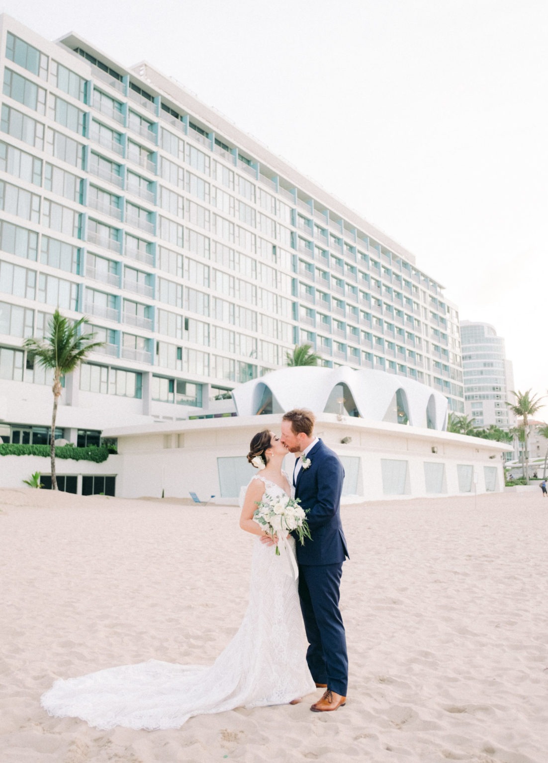 A couple kissing on the beach