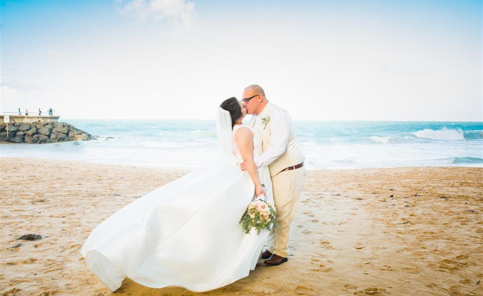 A couple kissing on the beach