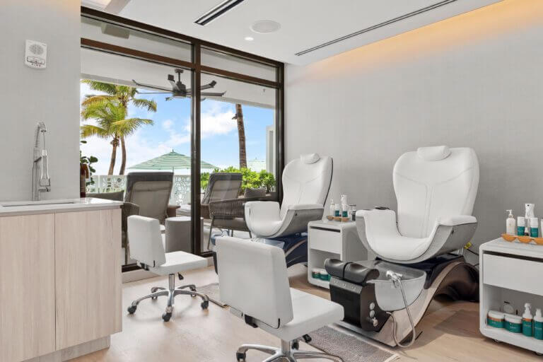 Luxurious pedicure chairs with a floor to ceiling window