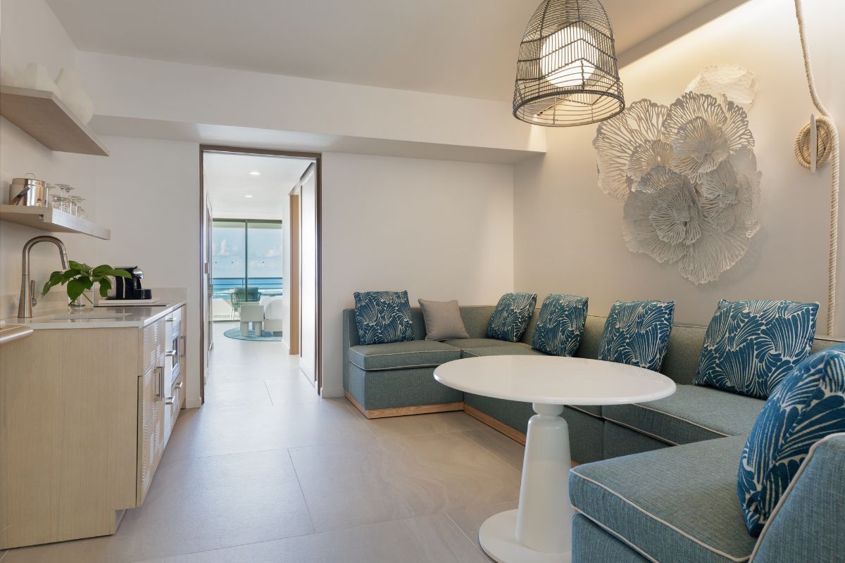 Living room with comfortable couch, kitchenette and view