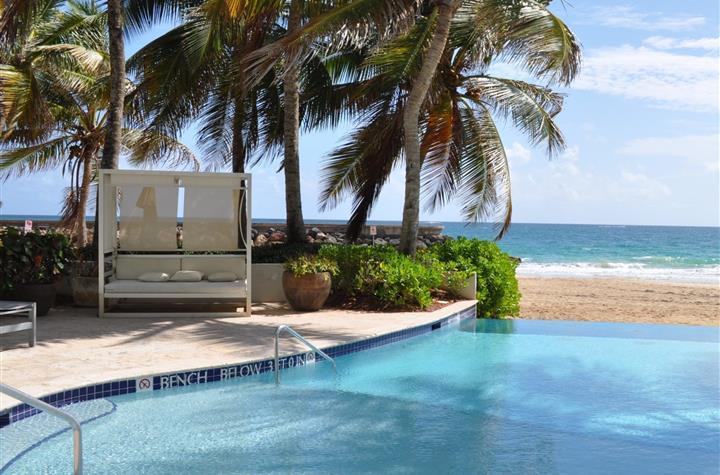 A cabana by the pool by the beach