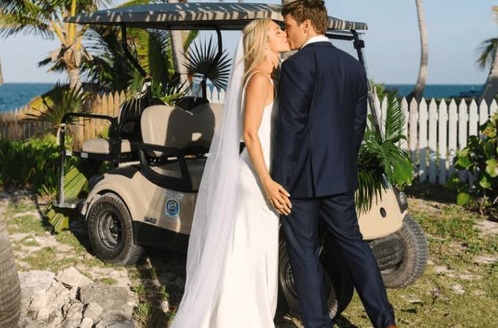 A bride and groom kissing one another