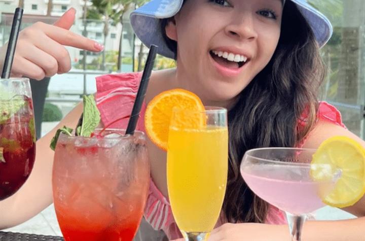 A woman drinking beverages