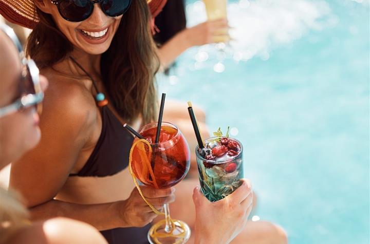 People having drinks by the pool