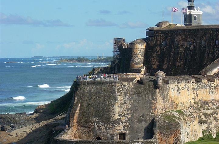 A fort alongside a cliff by the beach