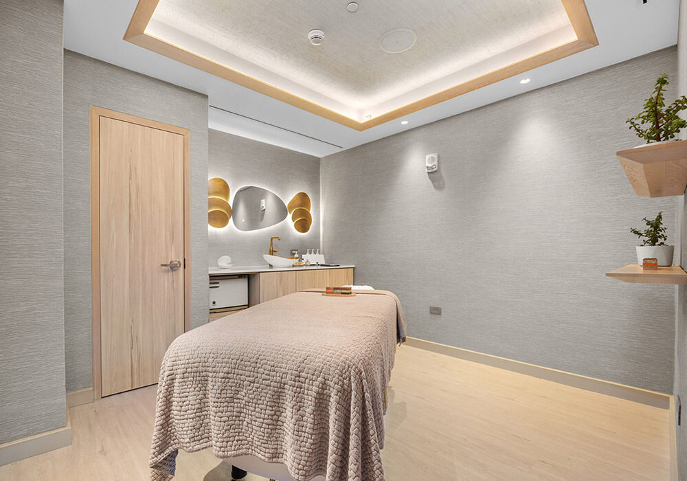 Indoor spa treatment room with recessed lighting