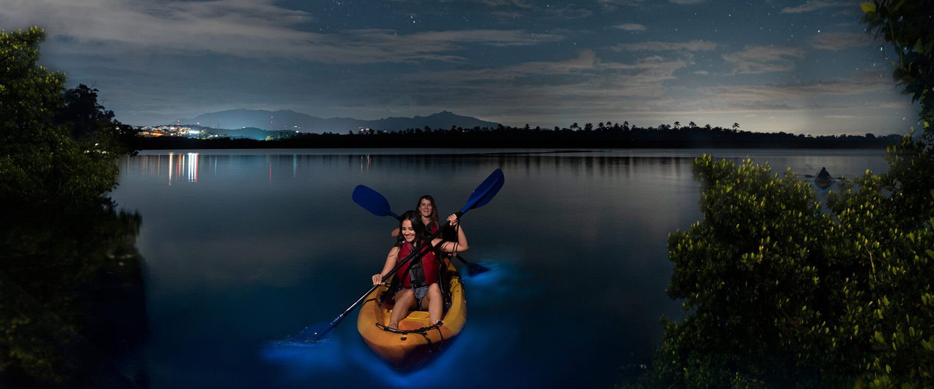 People on a kayak at night time