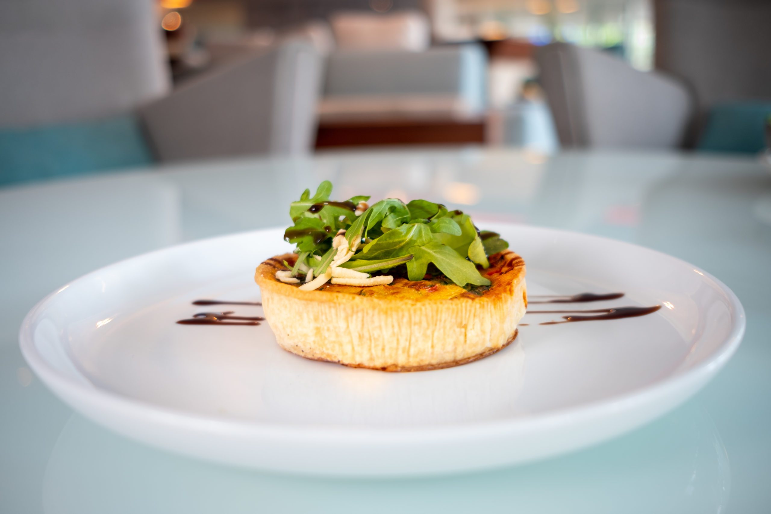 Aroma café quiche on plate at la concha san juan