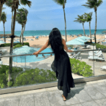 woman overlooking pool and beach at la concha resort