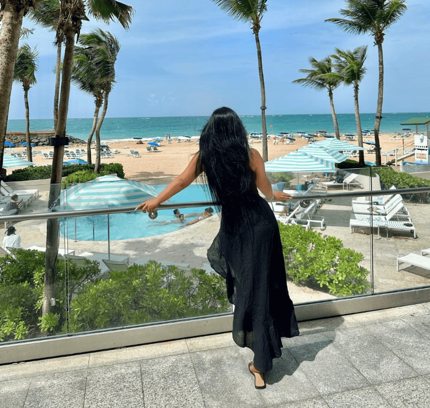 woman overlooking pool and beach at la concha resort