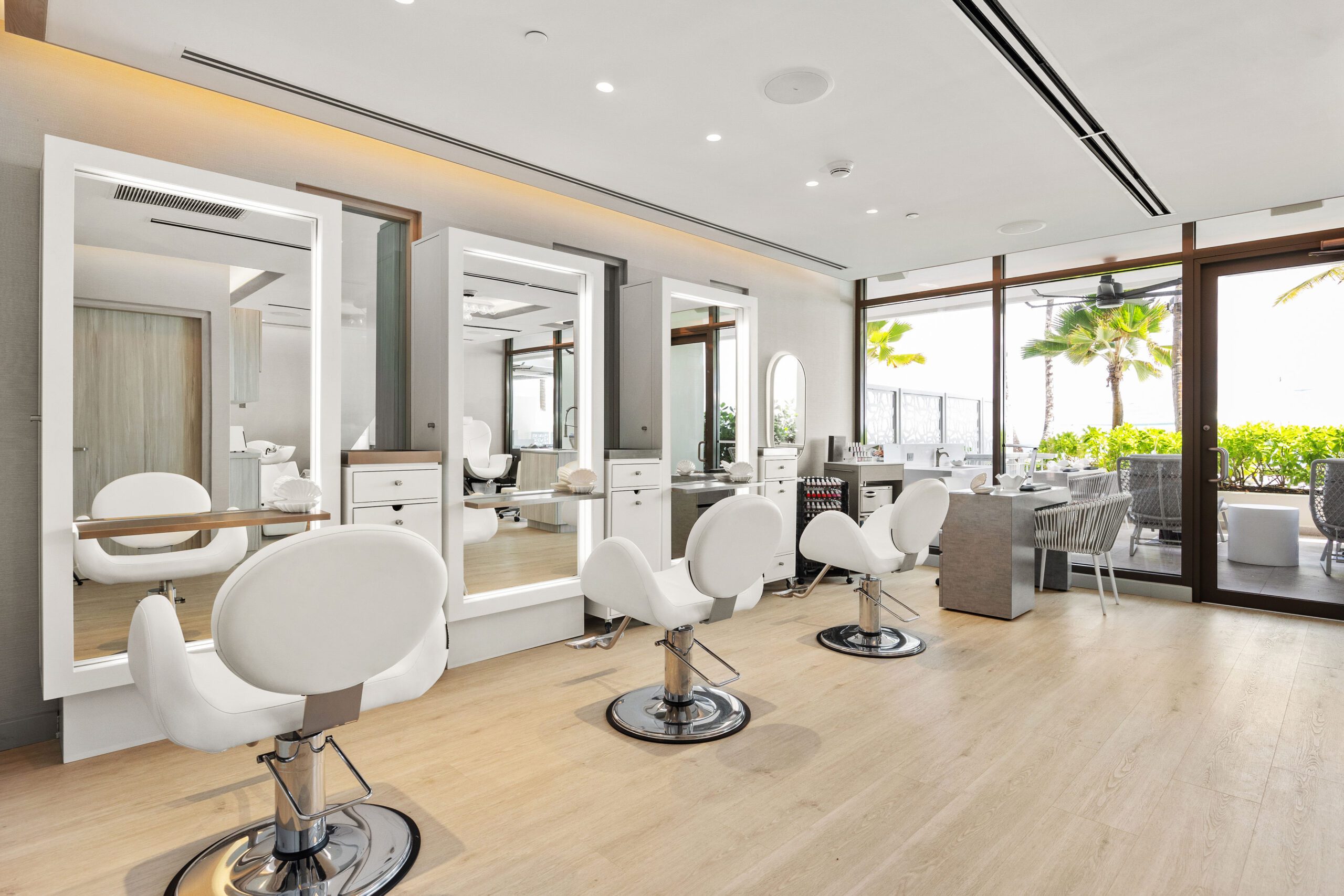 white seats and mirrors at the salon at la concha resort with ocean views