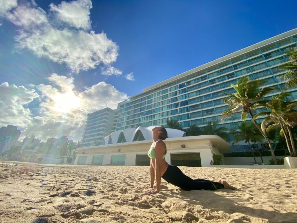 yoga in front of la concha at the beach