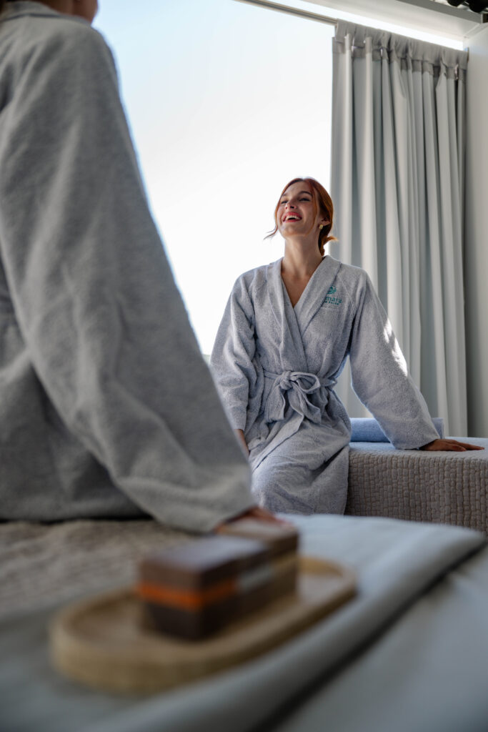 woman in bathrobe ready for massage at la concha resort