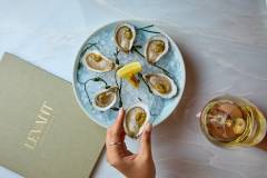 close up view of oysters and restaurant menu